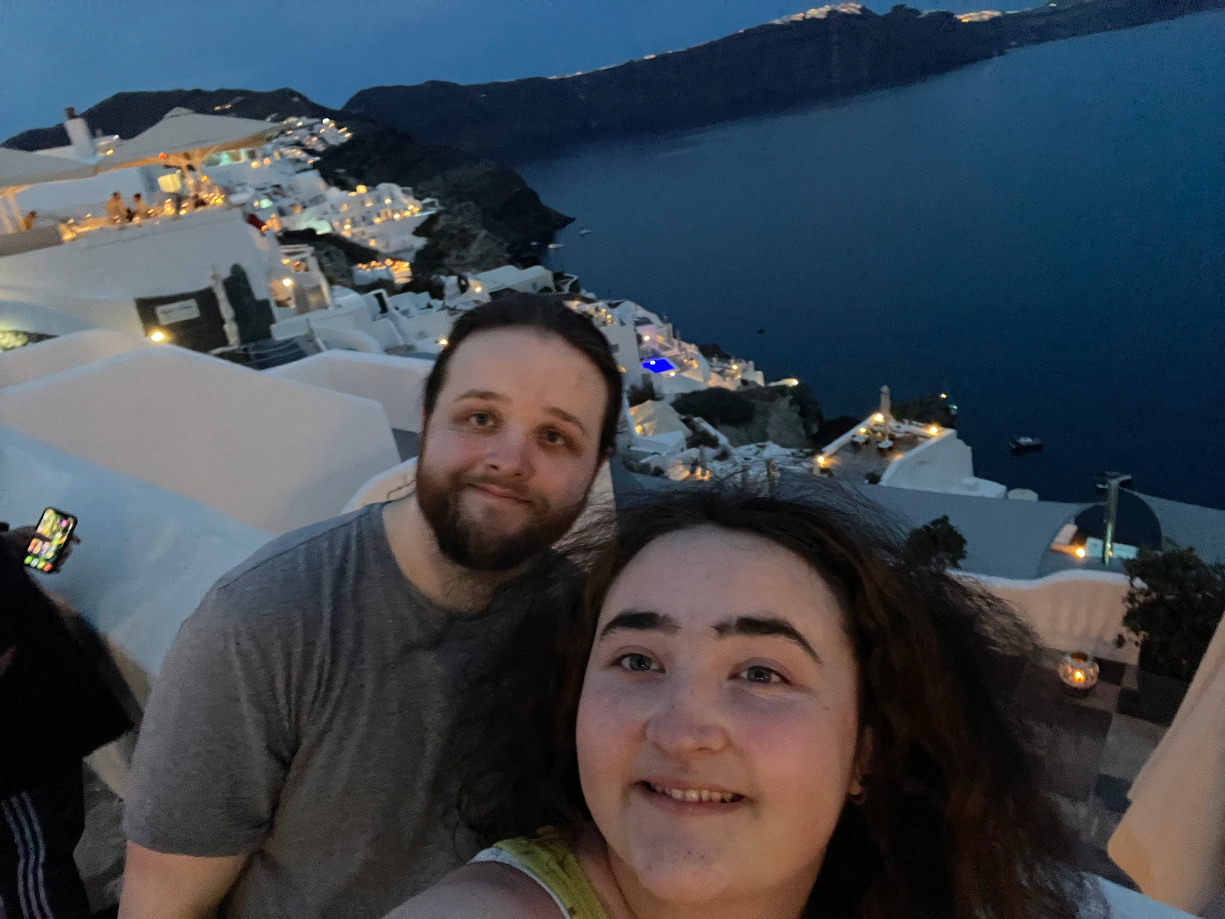 Faith and Brayton in Oia Santorini at twilight